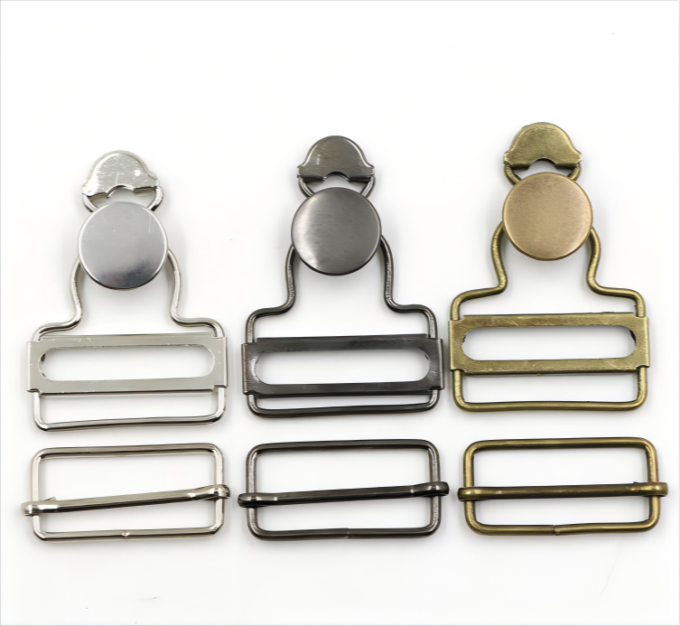 Close-up of an overall buckle in antique brass finish, highlighting vintage workwear style
